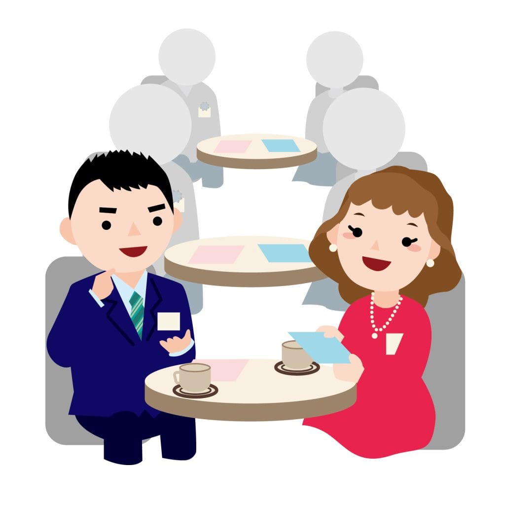 賑やかな婚活パーティーで笑顔で会話楽しむ男女の様子